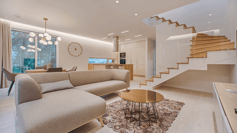 Interior shot of a new custom home with staircase behind glass.