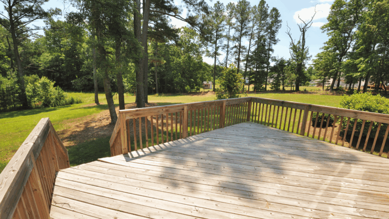 Custom wooden back deck and railing.